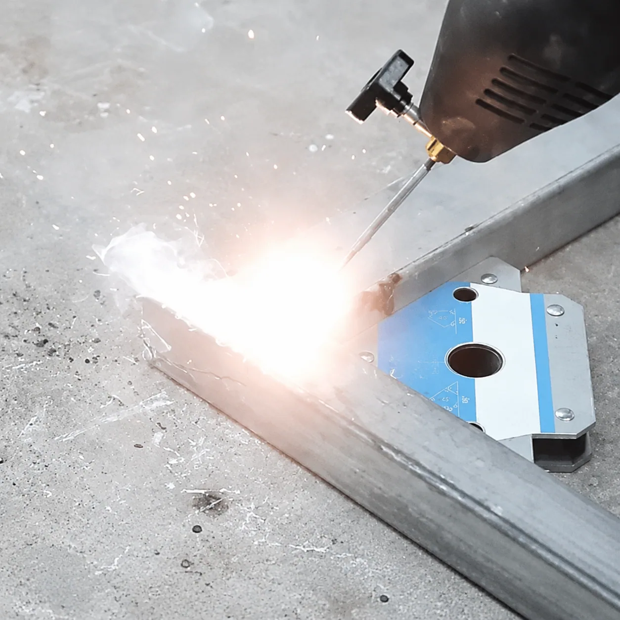Welding magnet positioned near an active weld