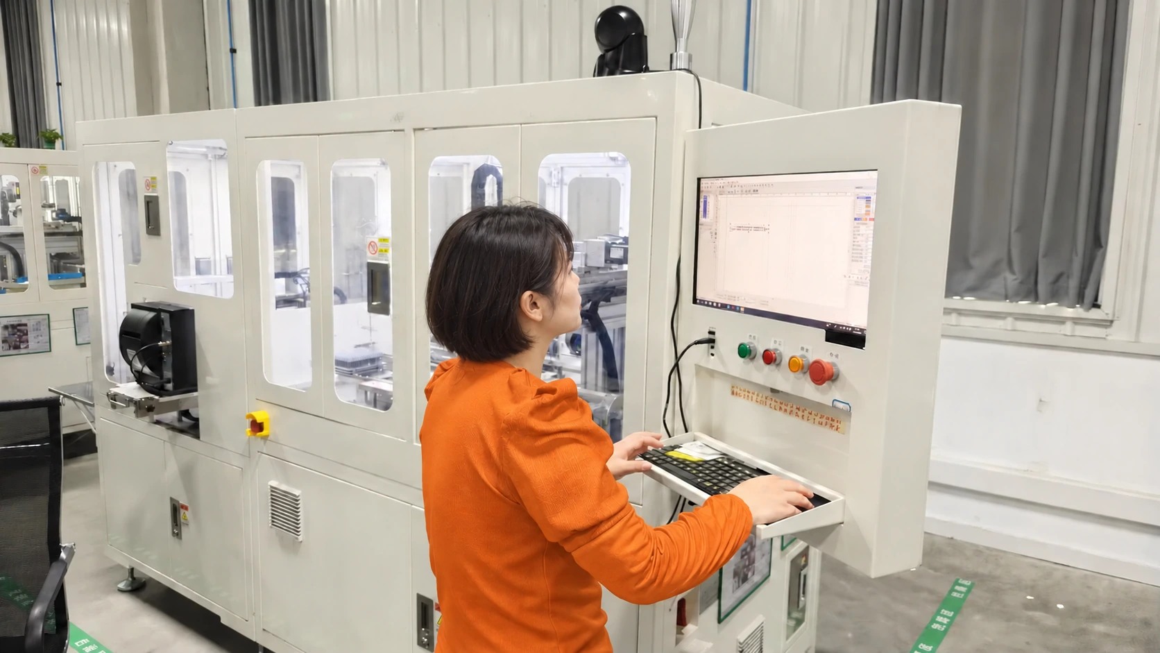An operator working at an enclosed laser-marking station — reference image for Solid Carbide Ball Nose End Mills