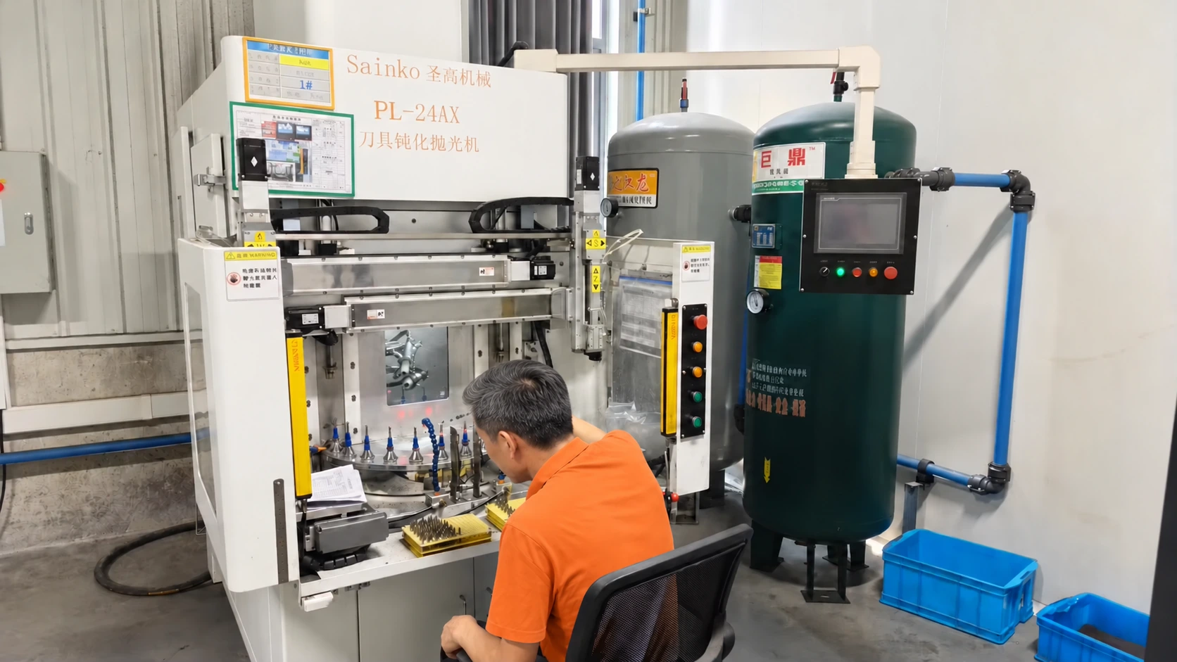 An operator beside a tool honing and polishing machine — reference image for Solid Carbide Ball Nose End Mills