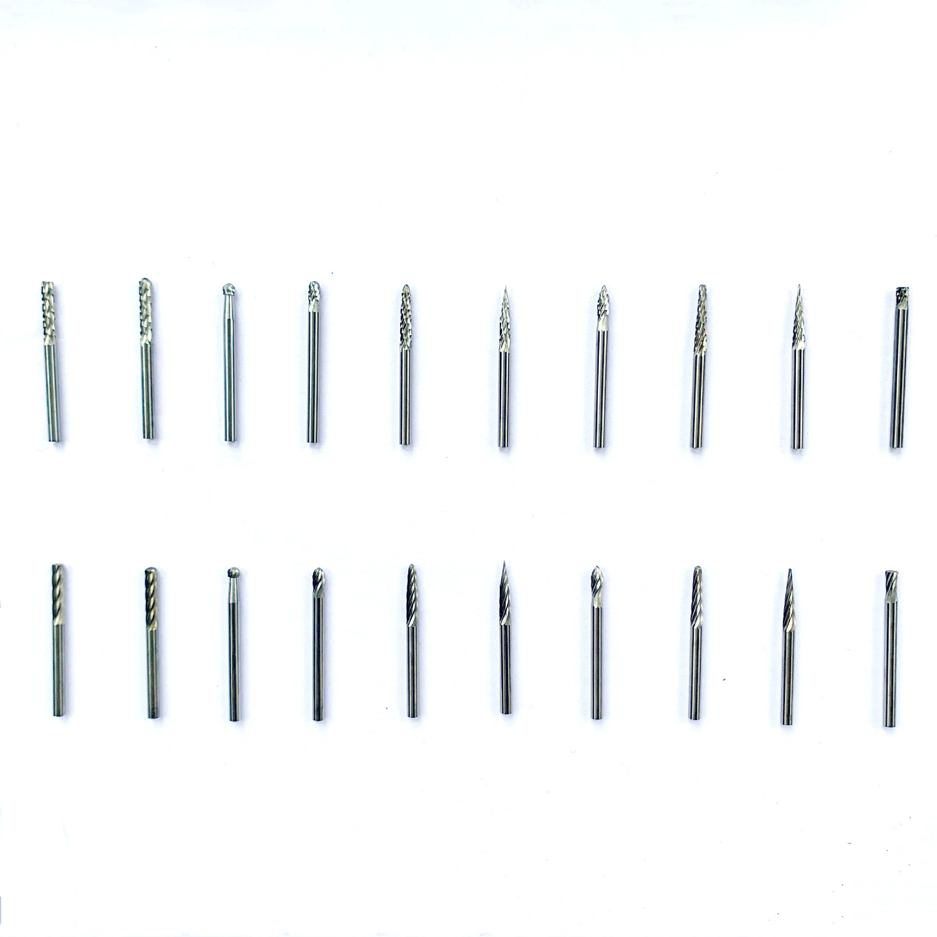 Twenty-piece 3 mm-shank carbide burr assortment showing multiple profile shapes