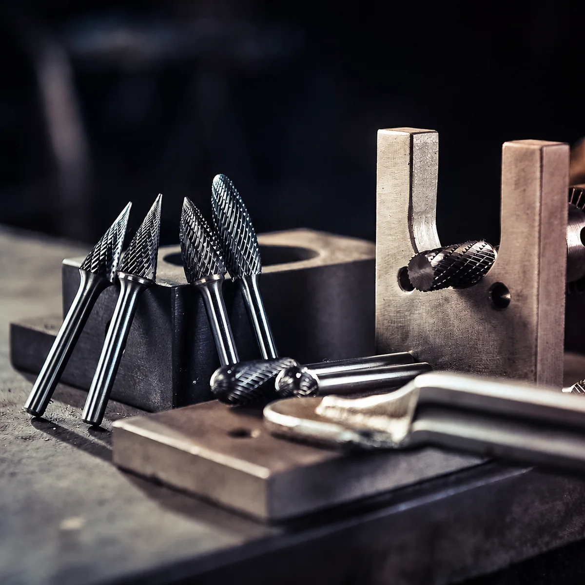 Carbide burr profiles with tooling components shown as mold and die cleanup context