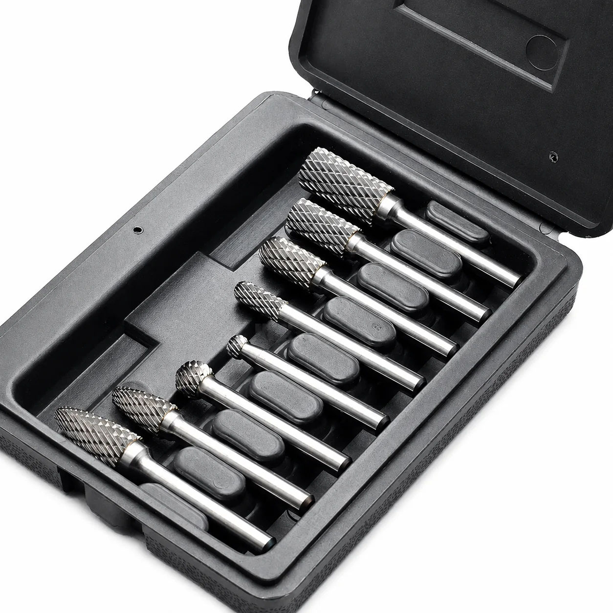 Double-cut carbide burr assortment separated in a molded black storage case